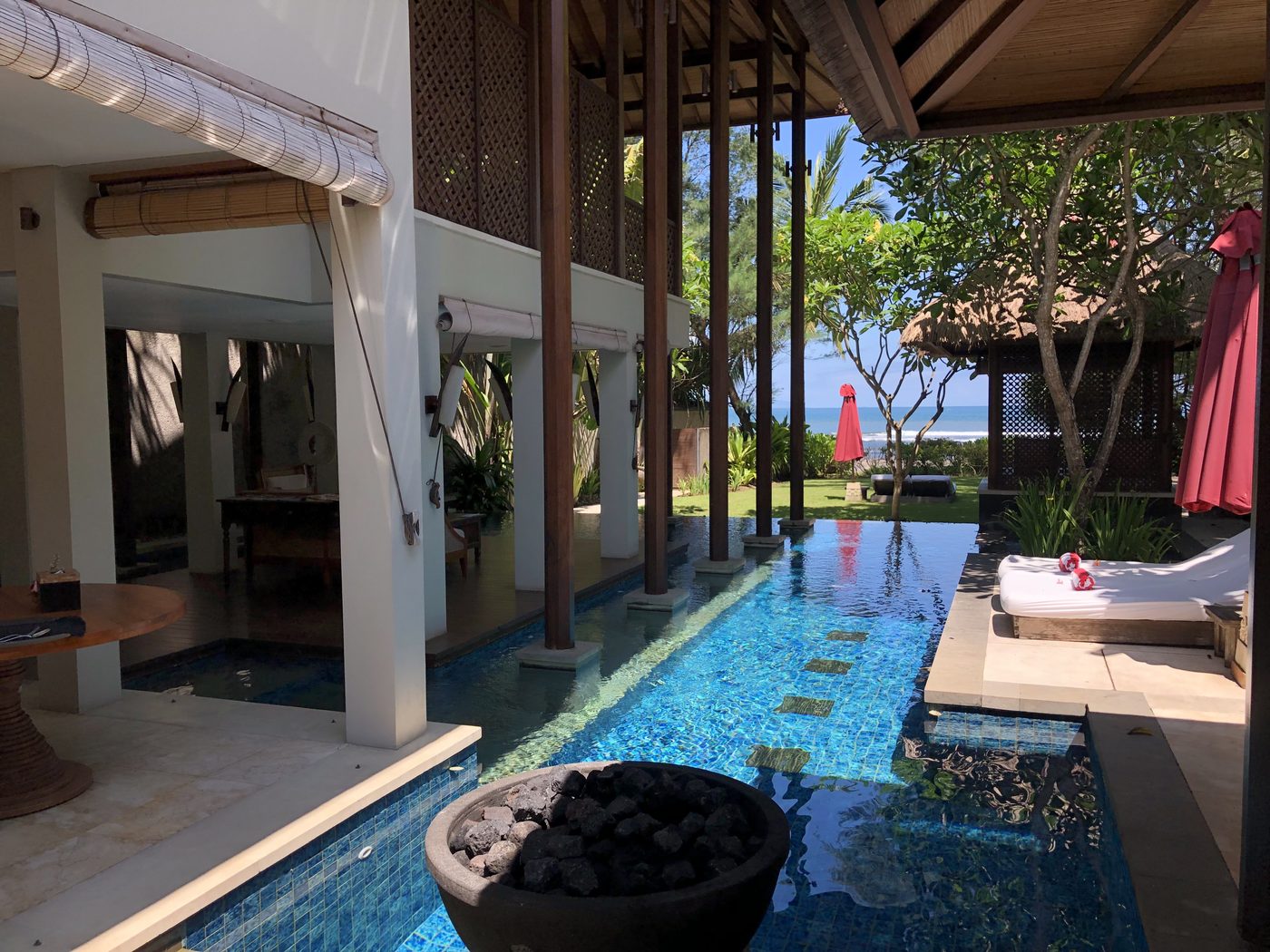 a villa pool running out to the sea