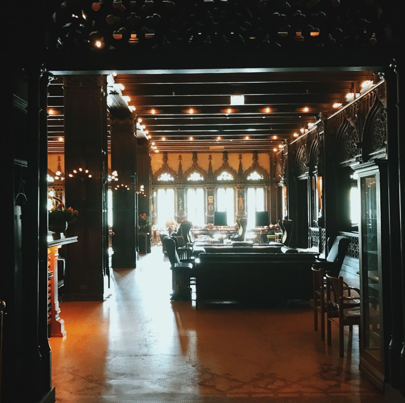 a lodge lobby, lamps lit