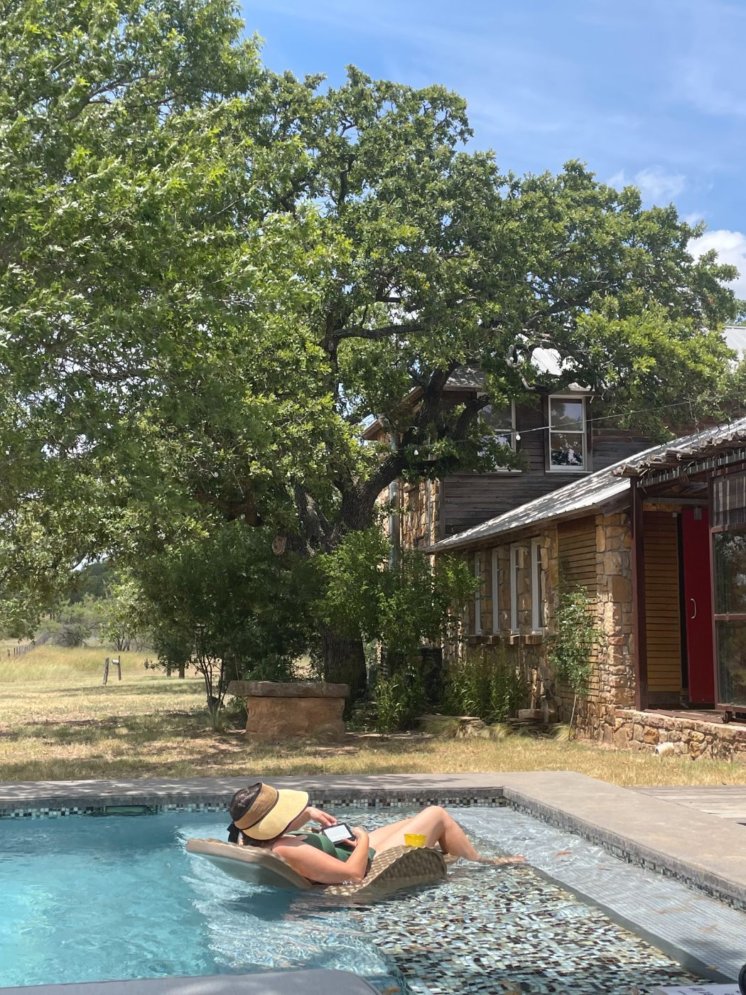 a stone cabin under oaks
